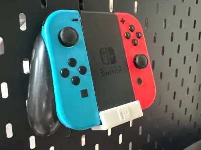 Switch controller pegboard holder (compatible with IKEA layout metal pegboard)