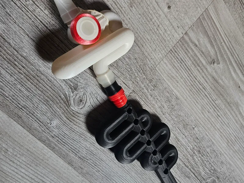 Bass membrane clarinet with evenly spaced holes