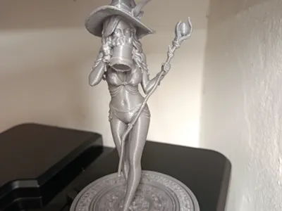 Beautiful witch drinking beer