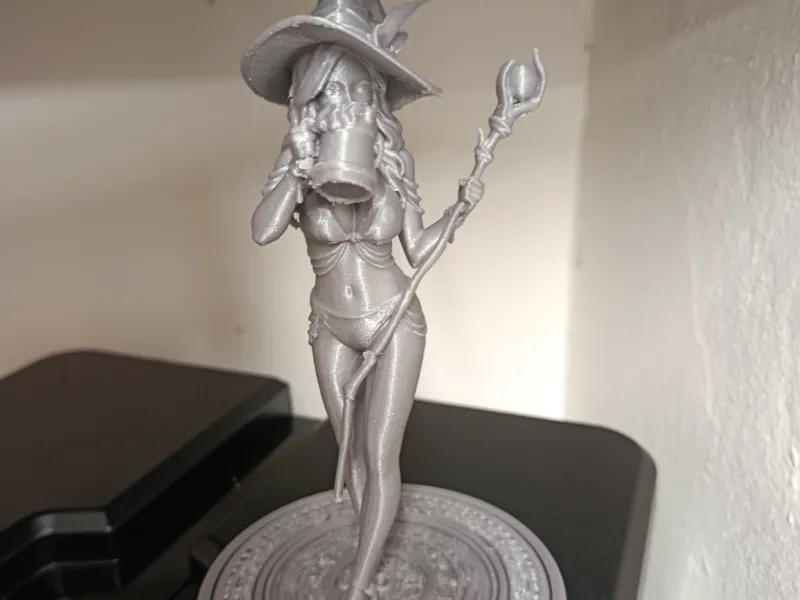 Beautiful witch drinking beer