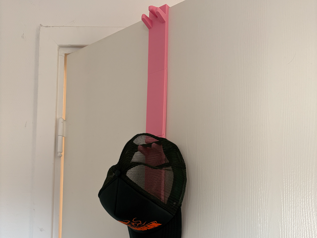 Modular cap hanger for door