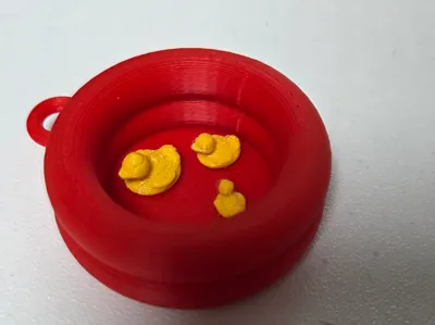 Duck keyring inside a tube