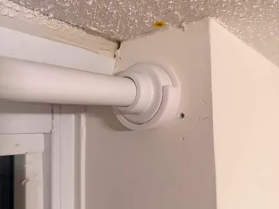 Curtain rod holder with screw holes