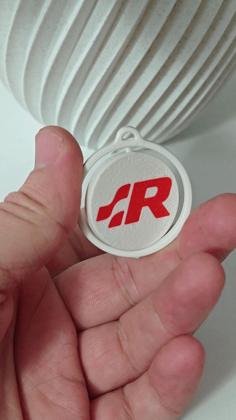 R Line spinning logo keychain