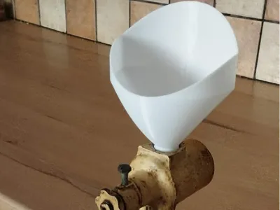 Funnel for poppy seed grinder