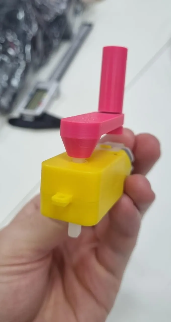 Fit the arm's hole onto the motor shaft (the white part that rotates). The crank should fit snugly to stay fixed without glue. If it's too tight or too loose, go back to step one and adjust the hole dimensions.