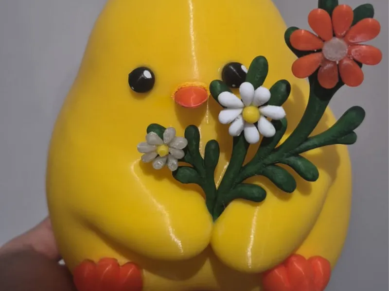 Pollito con flores