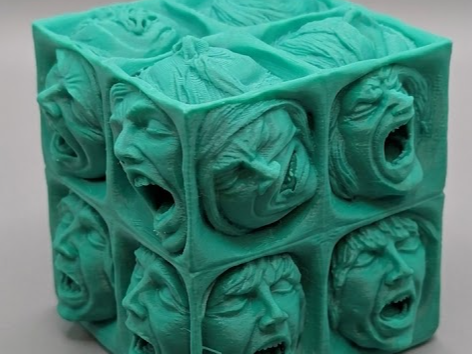 cube of screaming faces