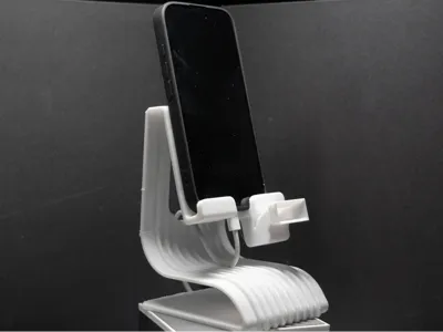 Phone stand with sound amplification