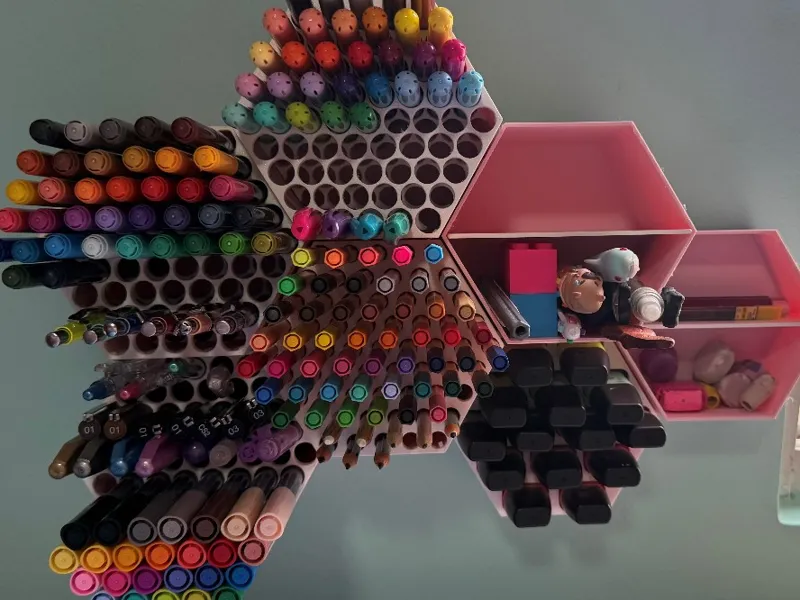 Modular hexagonal wall-mounted pen organizer