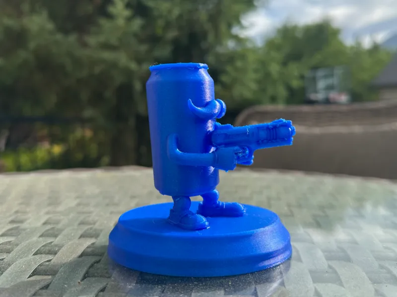 funny soda can holding gun