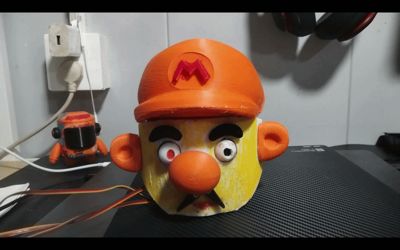Mario's Big Head (Eye-rolling and Moustache-wiggling ESP32 Controlled Model)