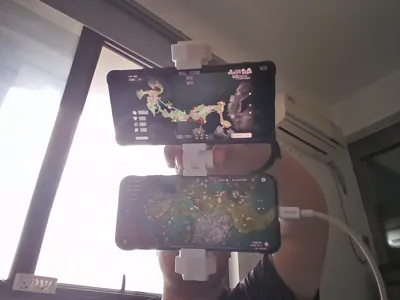 Dual phone stand for watching guides while playing games