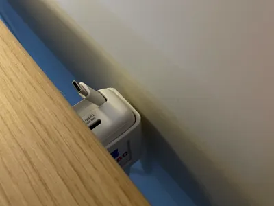 Retractable charger desk holder 