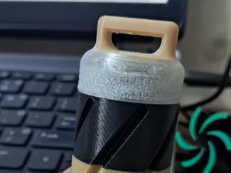 “container that can be attached to a keychain.”