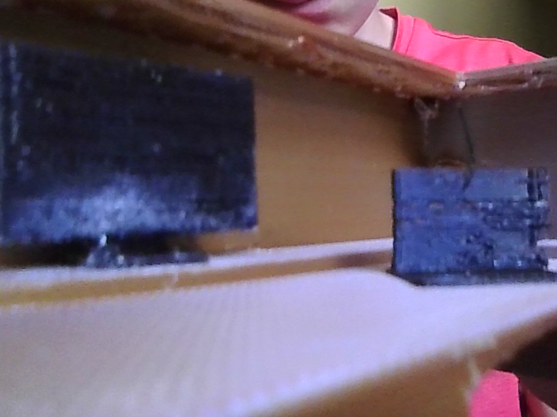 mini model of a laptop and monitor.