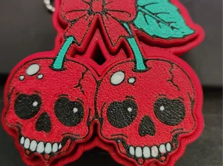 Cherry skulls clicker keychain/bag charm