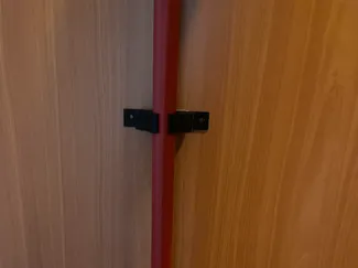 Wall-mounted broom holder