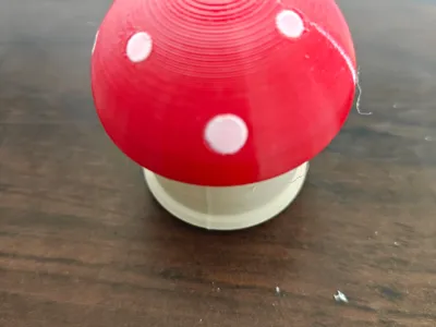 Toadstool — twist-open candy capsule