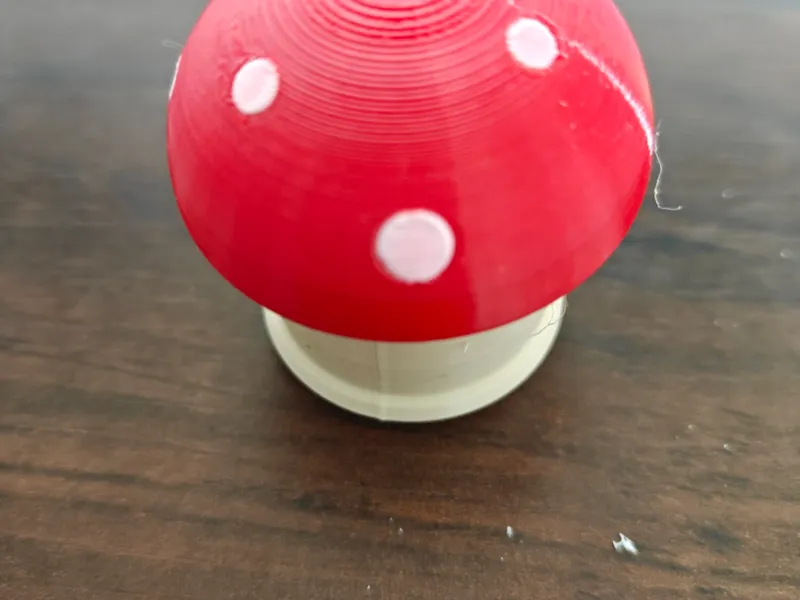 Toadstool — twist-open candy capsule