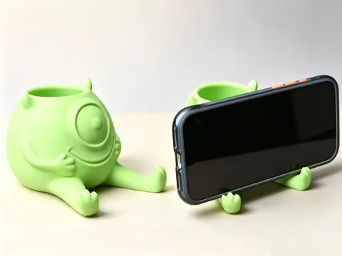 Modelo para impresión 3D: 大眼萌笔筒手机支架 — referencia de MakerWorld