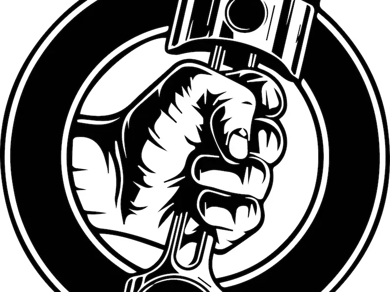 mechanic holding a piston