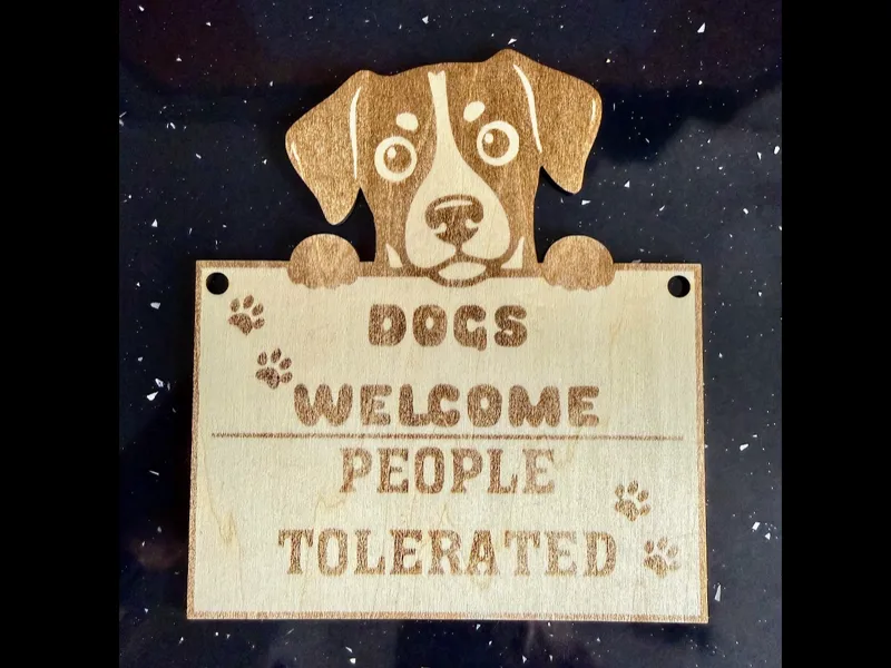 Dogs welcome, people tolerated sign 