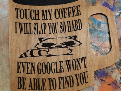 Don't touch a grumpy raccoon's giant coffee mug!