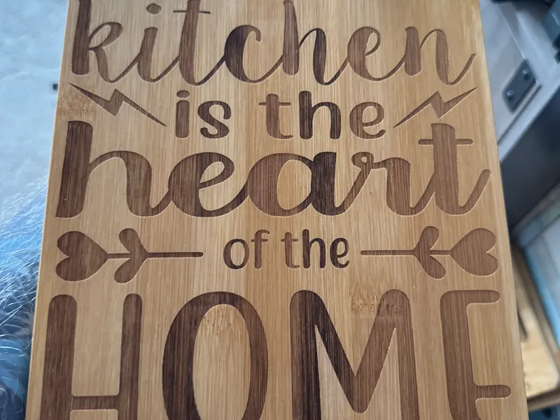Kitchen is the heart of the Home chopping /cutting