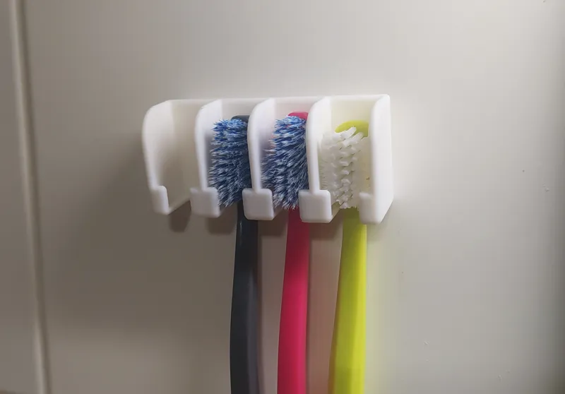 Wall toothbrush holder