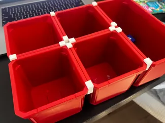 Packout large bin connector bracket