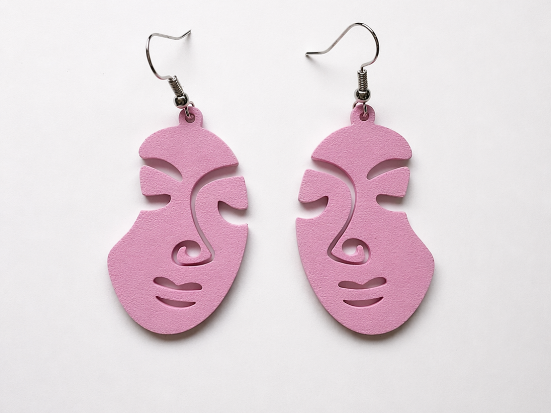 Pendientes aretes caras abstractas y minimalistas