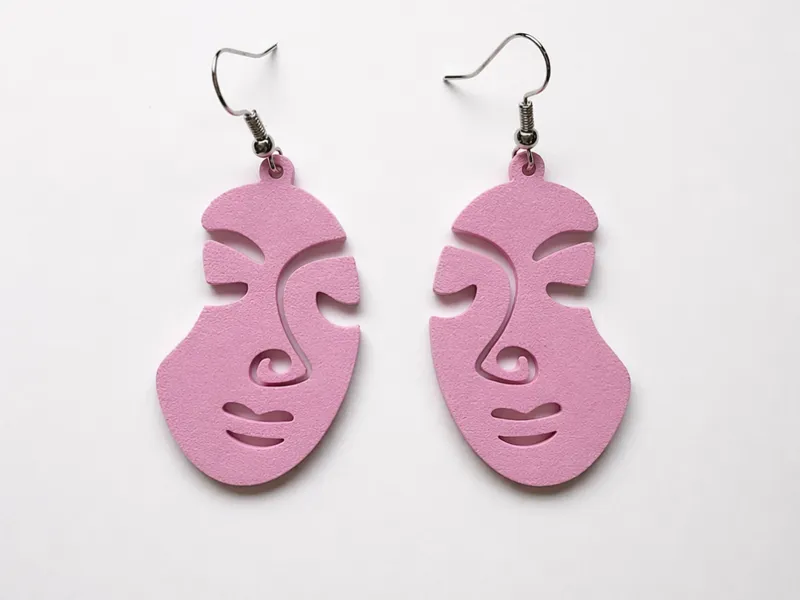 Pendientes aretes caras abstractas y minimalistas