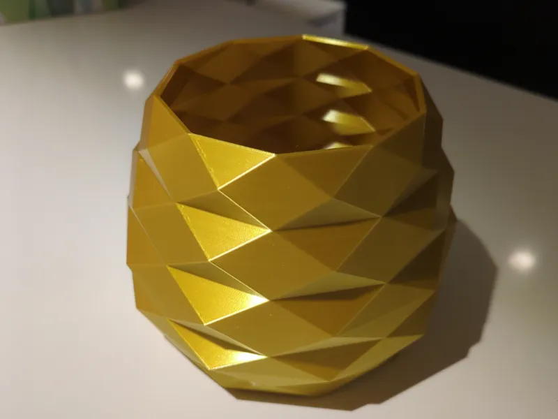 The low poly golden vase