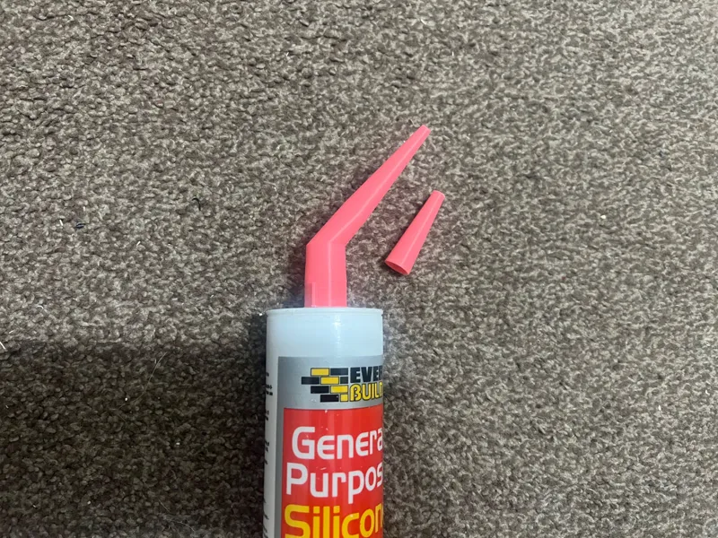 Angled silicone nozzle with cap