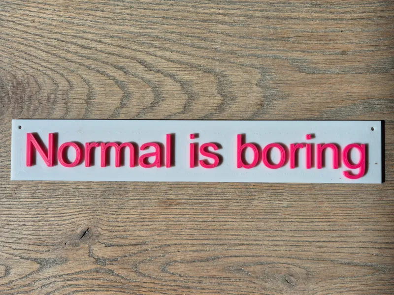 Normal is Boring sign