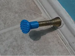 Door stop spring cover