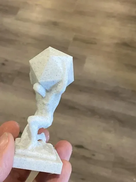 Atlas holding a D20