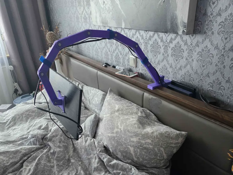 Portable monitor arm mount for lazy gaming.