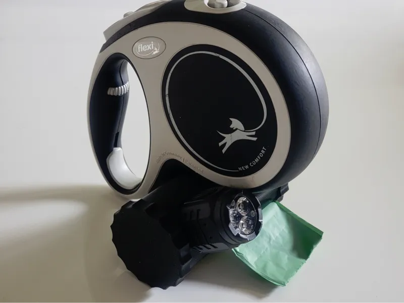 Poop bag holder with flash light mount 