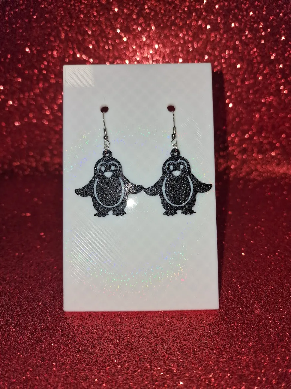 A penguin earrings view 2