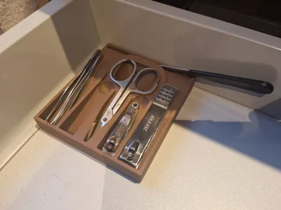 Bathroom organizer for tweezers and clippers