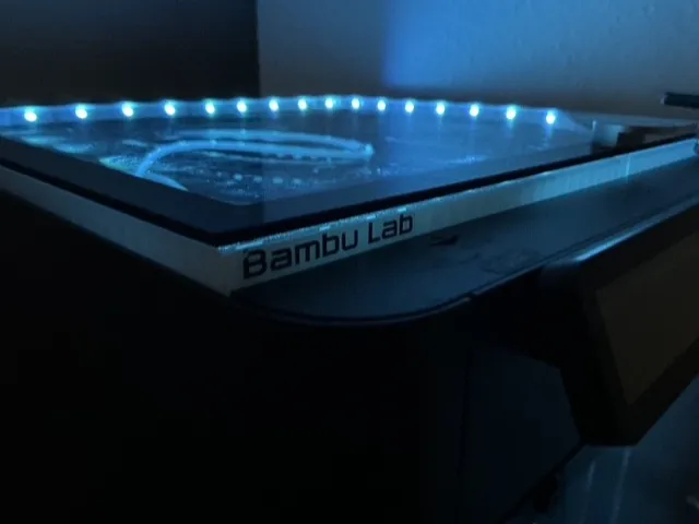 Raised glass plate for an LED strip