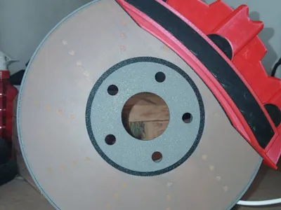 Glowing brake disc-shaped lamp