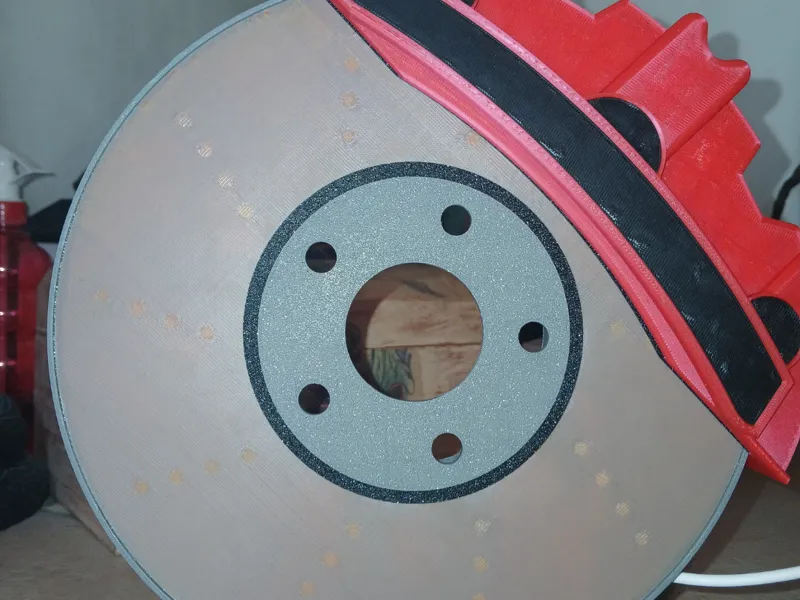 Glowing brake disc-shaped lamp
