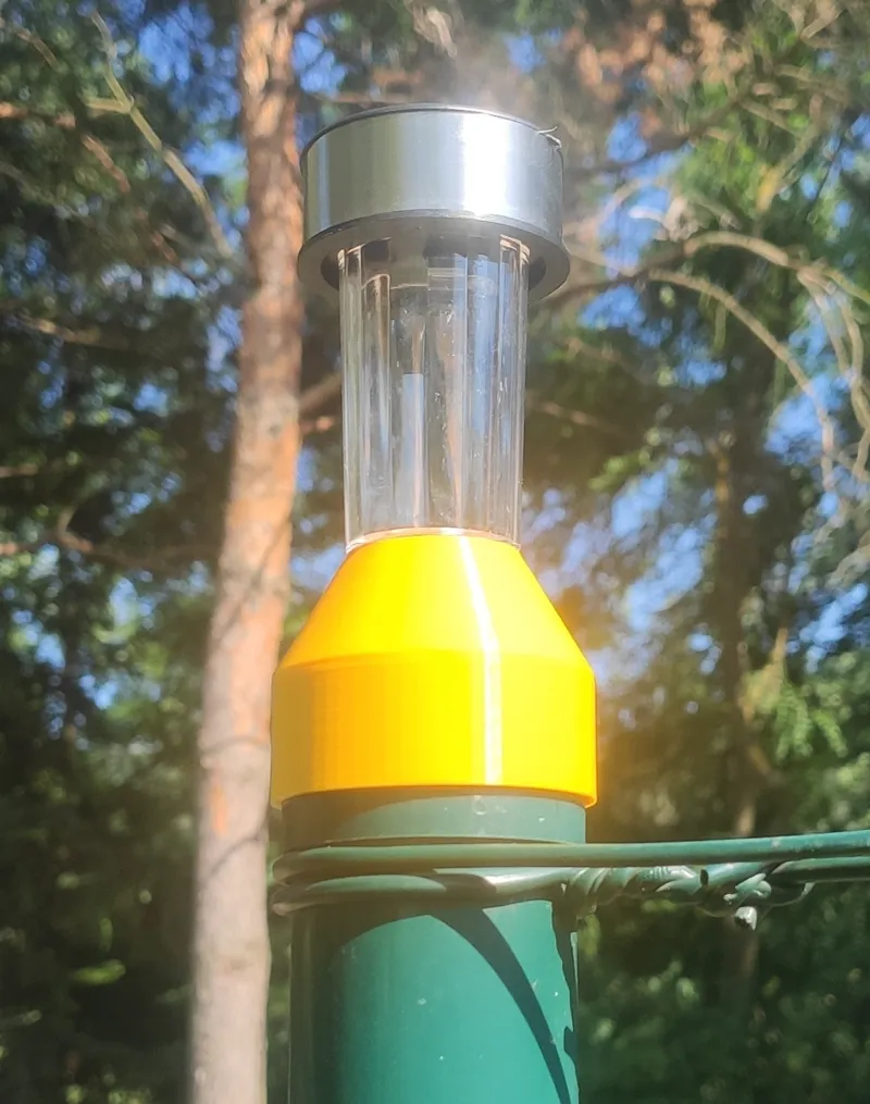 Lamp fence holder