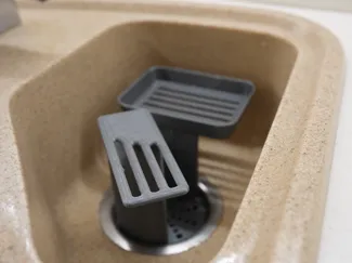 Kitchen sink sponge and cloth holder