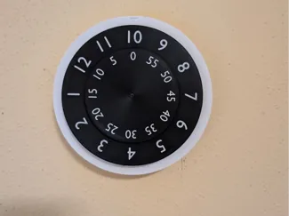 Clock with spinning clockface (AMS)