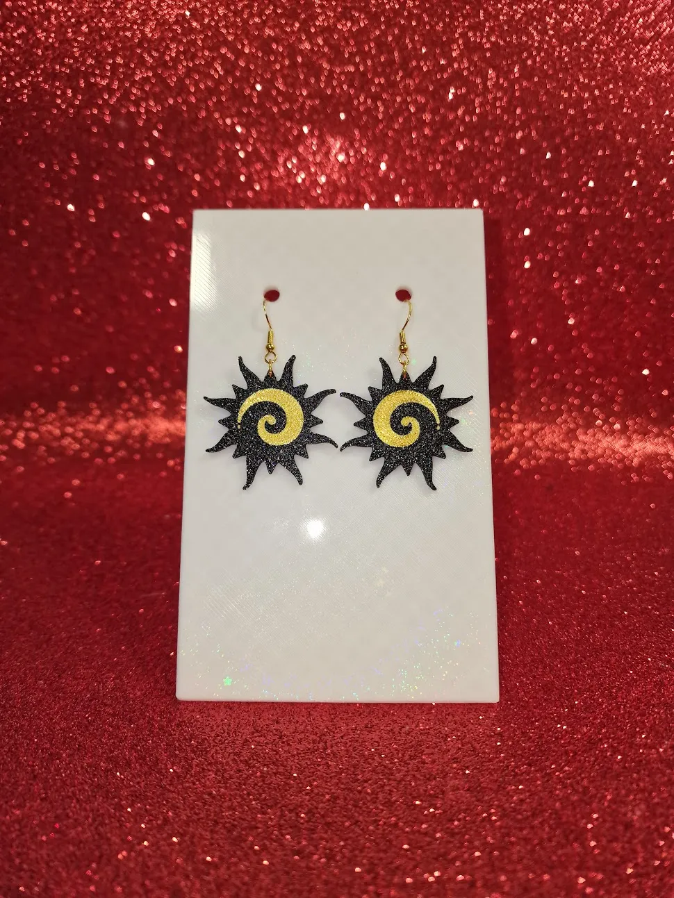 Spiral sun earrings view 2