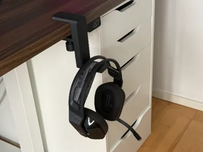Rotating headset holder under desk